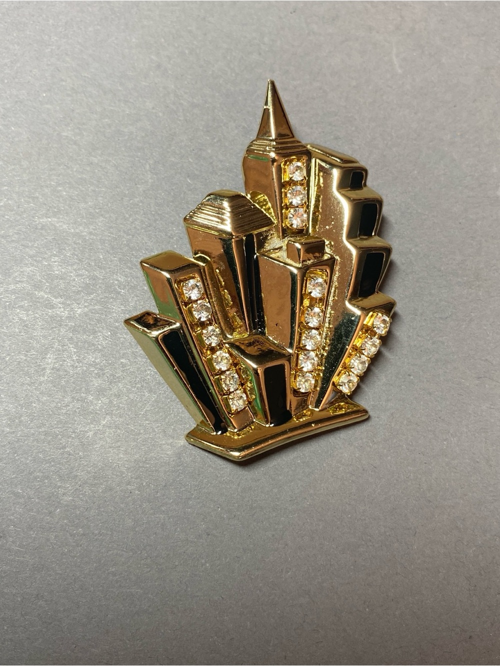 Vintage AJC city skyline gold rhinestone brooch pin
